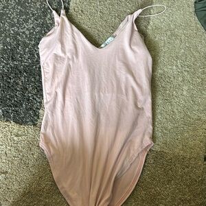 Never worn baby pink body suit